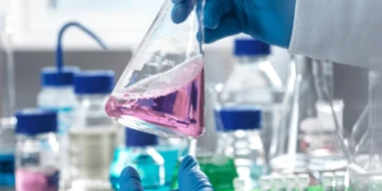 closeup-scientists-hands-holding-flask-260nw-2452726337 defoamer